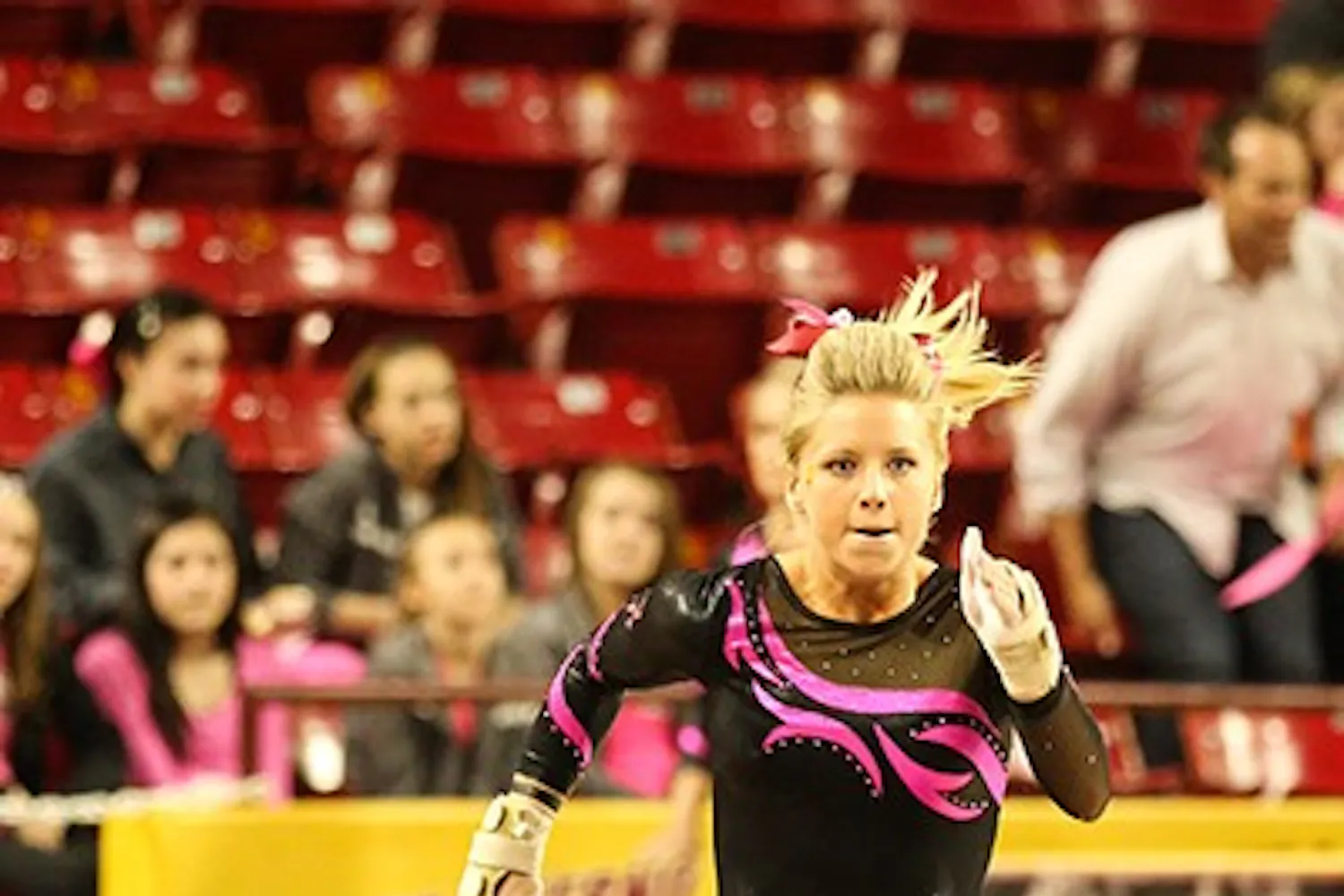Sophomore Carissa Kraus runs down the vault runway during a home meet against BYU on Feb. 15. (Photo by Arianna Grainey)