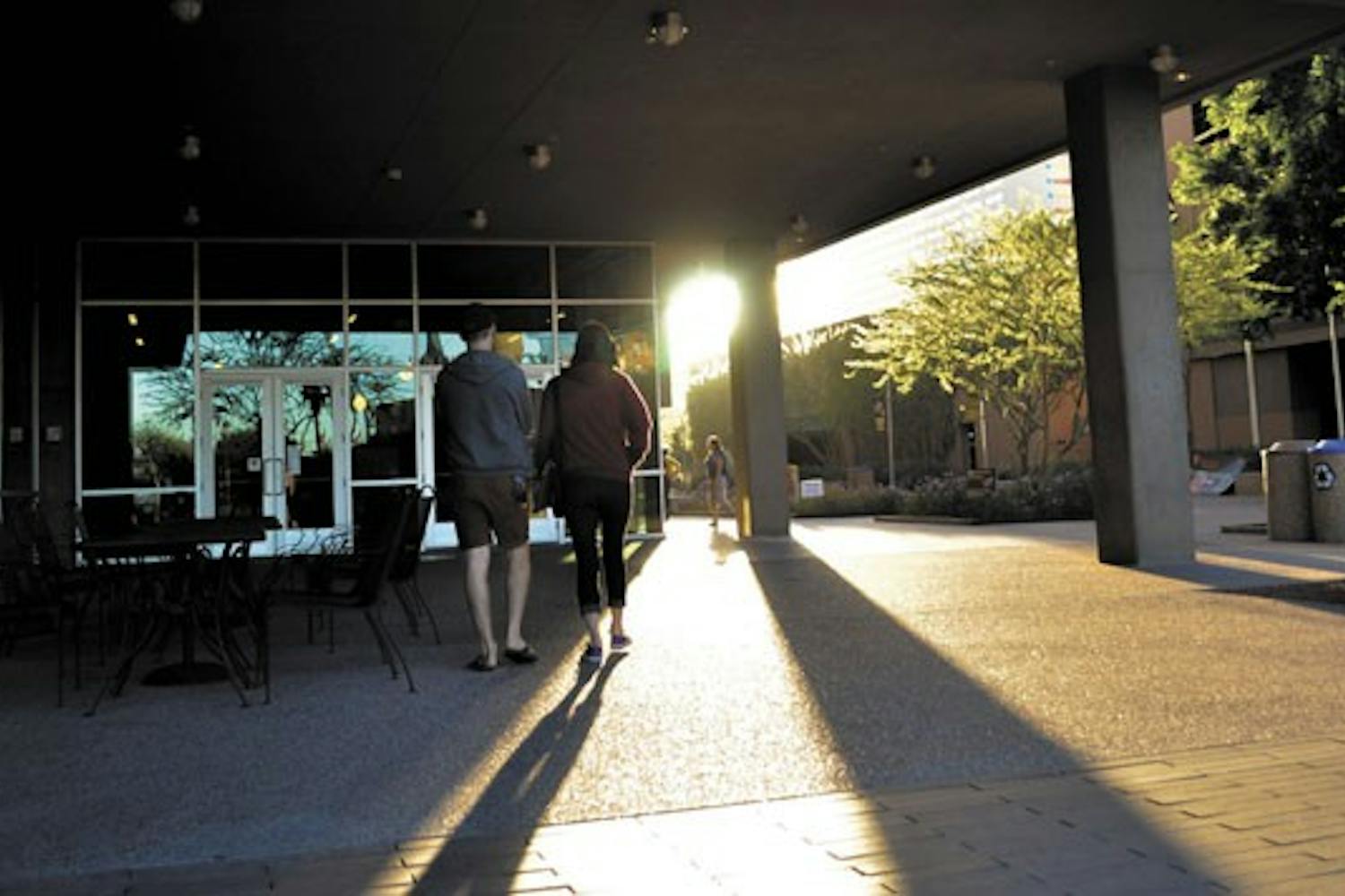 Students meander to their early Monday morning classes at the Walter Cronkite School of Journalism and Mass Communication on the downtown Phoenix campus as the sun begins to rise. (Photo by Danielle Gregory)