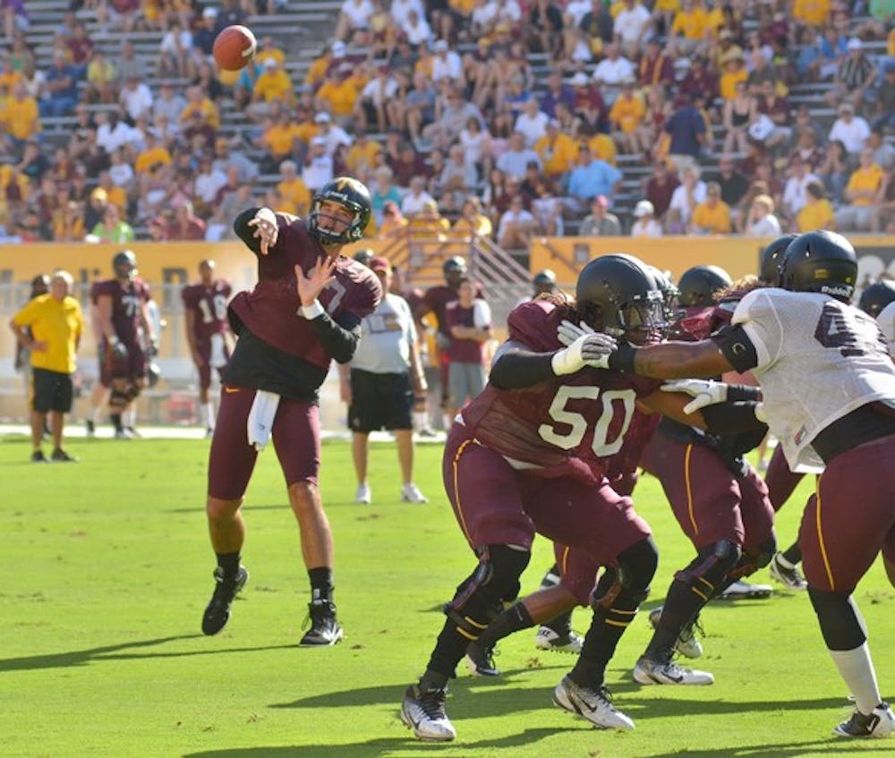 TEAM LEADERS: ASU junior quarterback Brock Osweiler makes a pass during the Sun Devil’s scrimmage on Saturday. Osweiler was named one of the team captains, along with redshirt senior offensive lineman Garth Gerhart and redshirt senior linebacker Colin Parker. (Photo by Aaron Lavinsky)