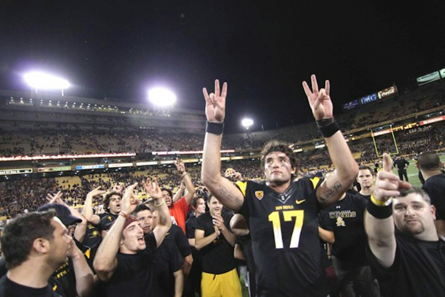 THE BIG ONE: ASU junior quarterback Brock Osweiler celebrates with the student section after the Sun Devils’ OT win over Missouri on Sept. 9. Saturday’s game against Oregon is shaping up to be the biggest regular-season game of the year. (Photo by Lisa Bartoli)