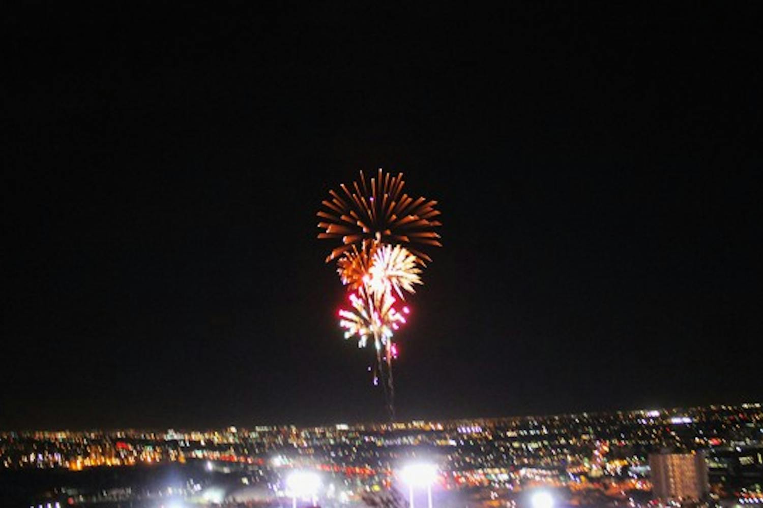 Fireworks shoot into the air above Sun Devil Stadium, after ASU's last touchdown during the ASU vs. Oregon game Thursday night.  (Photo by Jenn Allen)
