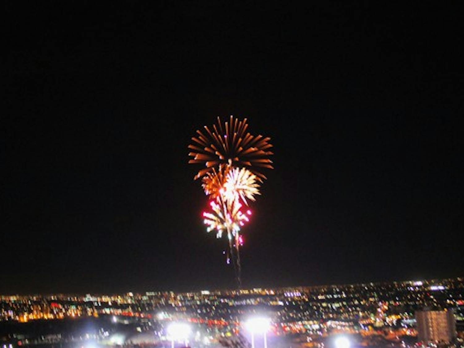 Fireworks shoot into the air above Sun Devil Stadium, after ASU's last touchdown during the ASU vs. Oregon game Thursday night.  (Photo by Jenn Allen)

