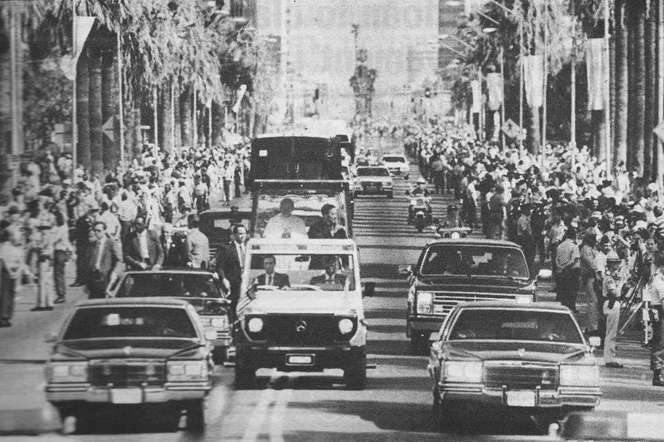 In this State Press file photo, rows of people line Central Avenue in Phoenix to glimpse Pope John Paul II in the “popemobile” en route to St. Mary’s Basilica on Tuesday, Sept. 15, 1987. (Courtesy of The Arizona Republic)