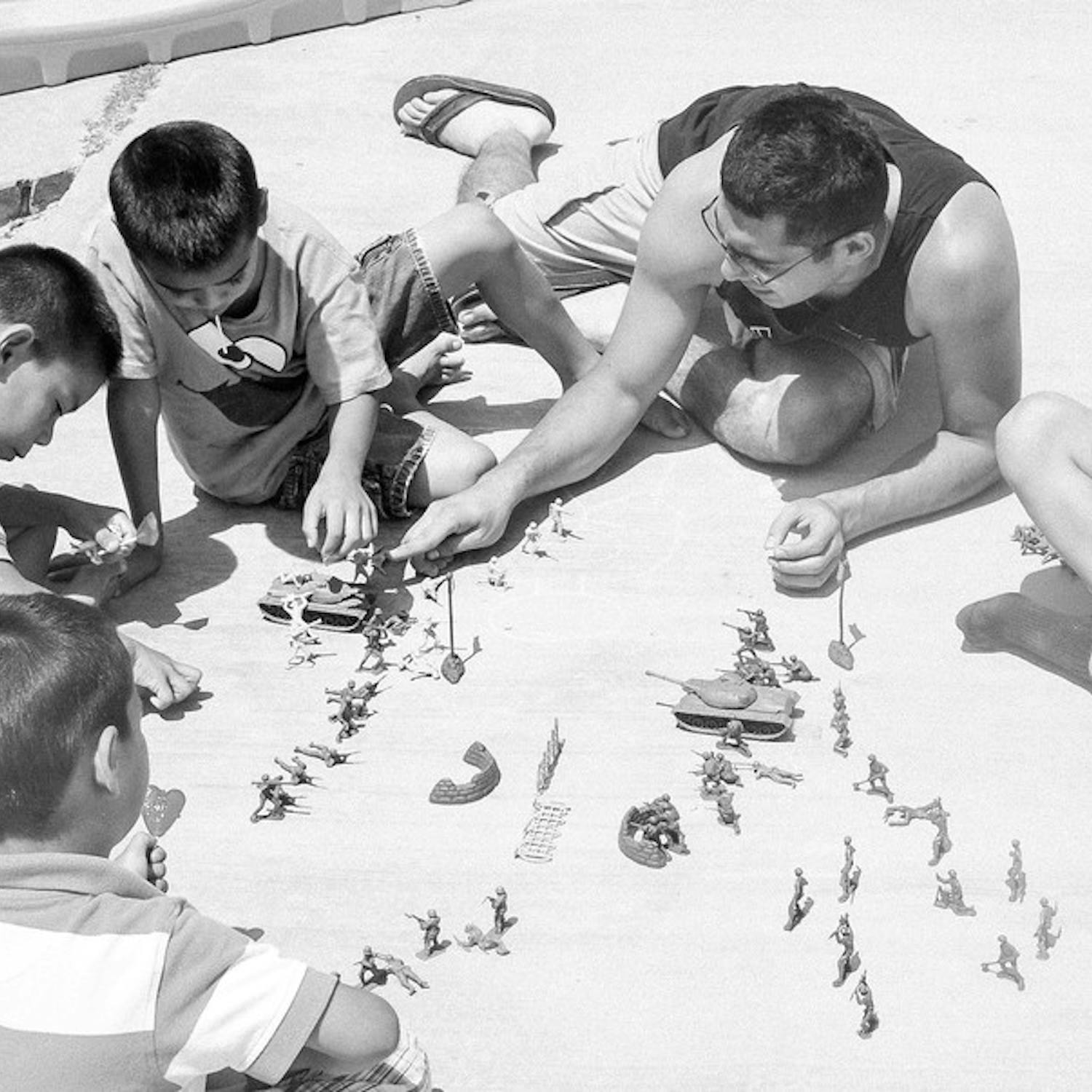 One Steps of Love Volunteer, a dental hygienist student from Fortis College, plays with the three children of the Sonoyta shelter. Photo by Jennifer Jermaine. 