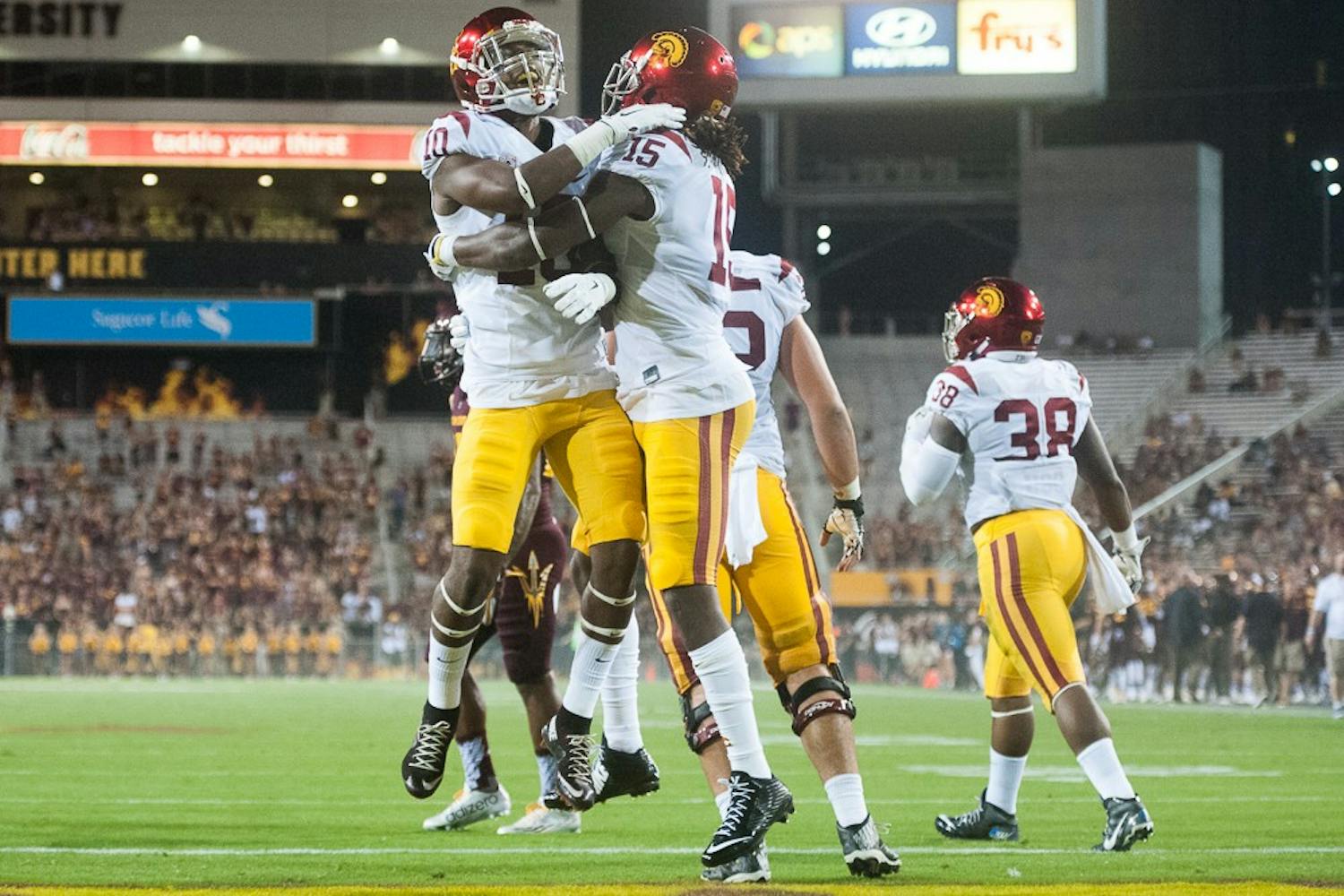 USC redshirt freshman wide receiver Jalen Greene (10) and redshirt junior wide receiver Isaac Whitney celebrate after a USC touchdown against ASU on Saturday, Sept. 26, 2015, at Sun Devil Stadium in Tempe. The Trojans defeated the Sun Devils 42-14.