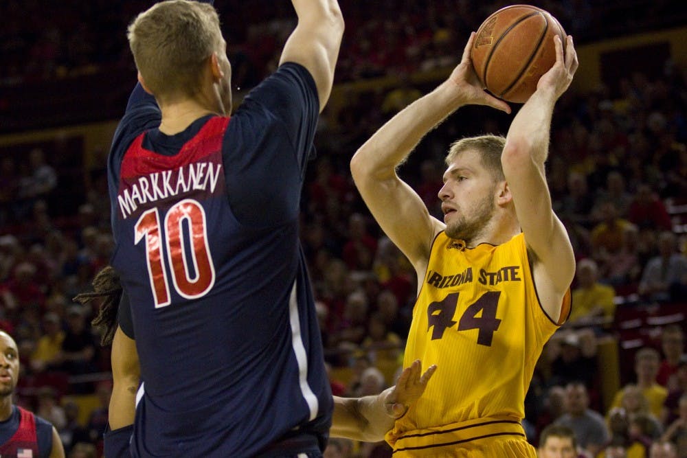 ASU junior guard Kodi Justice (44) looks to pass the ball after getting stuck driving during a men's basketball game versus the no. 7 ranked Arizona Wildcats in Wells Fargo Arena in Tempe, Arizona on Saturday, March 4, 2017. ASU lost 73-60. 