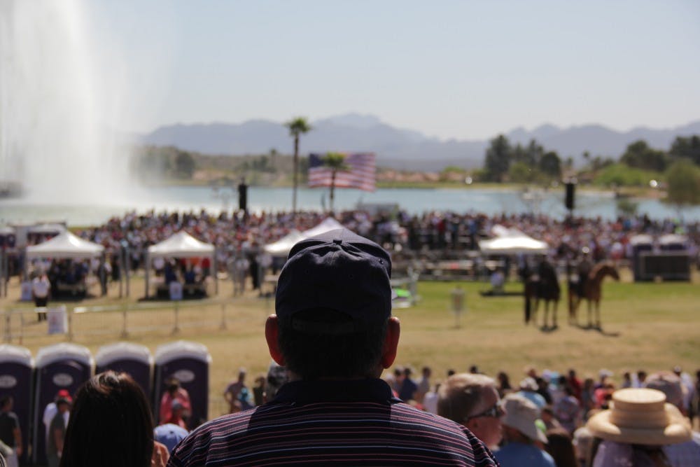 A man overlooks the stage where Donald Trump addressed a crowd of 10,000 Saturday in Fountain Hills.