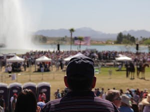 A man overlooks the stage where Donald Trump addressed a crowd of 10,000 Saturday in Fountain Hills.
