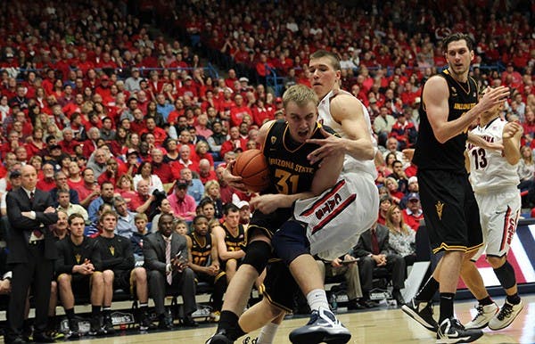 Sophomore forward Jonathan Gilling takes the ball to the hoop against UA in Tucson. Gilling hails from Denmark and in the 2011-2012 season had 21 points against UA overall, according to thesundevils.com. (Photo by Dominic Valente)