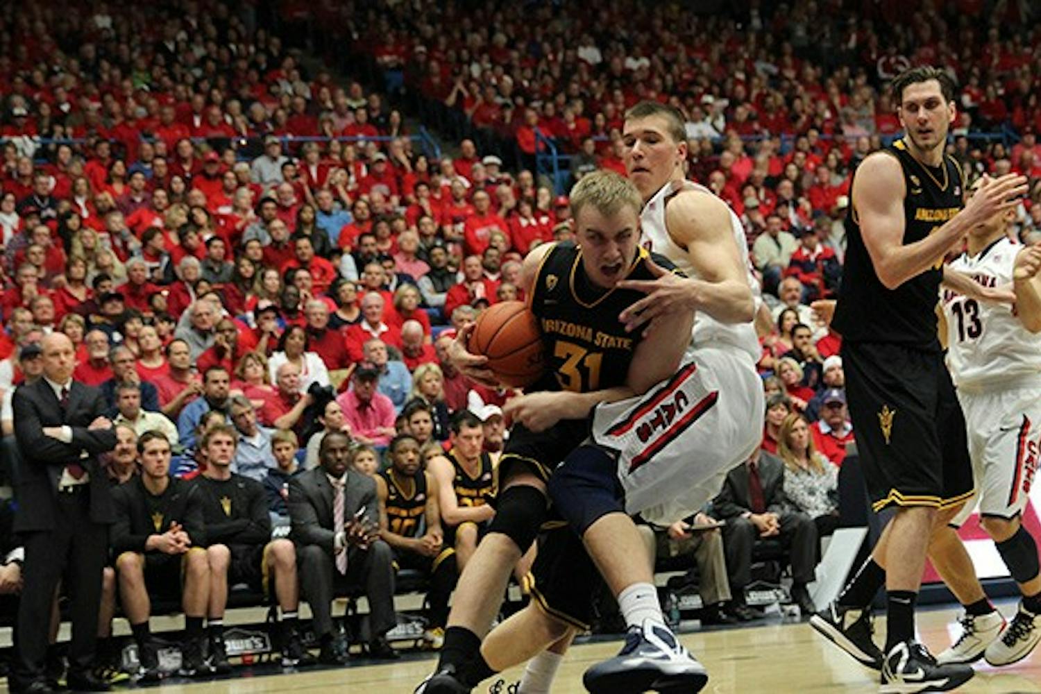 Sophomore forward Jonathan Gilling takes the ball to the hoop against UA in Tucson. Gilling hails from Denmark and in the 2011-2012 season had 21 points against UA overall, according to thesundevils.com. (Photo by Dominic Valente)