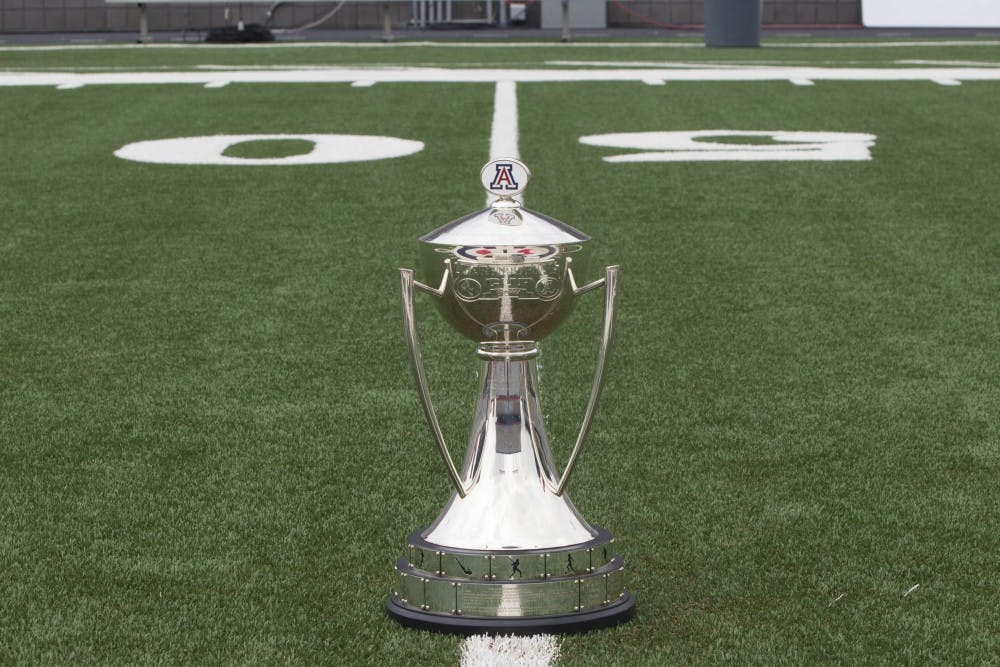The Territorial Series Cup is displayed on the field at UA's football stadium. The cup currently resides on UA's campus, in the Jim Click Hall of Champions. (Photo by Dominic Valente)