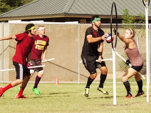 Paulo Avelar (left), Jacob Lawson, Alex Browne and Tori Kaiser compete in the Tempe Brawl Quidditch tournament on Oct. 17, 2015 in Tempe.