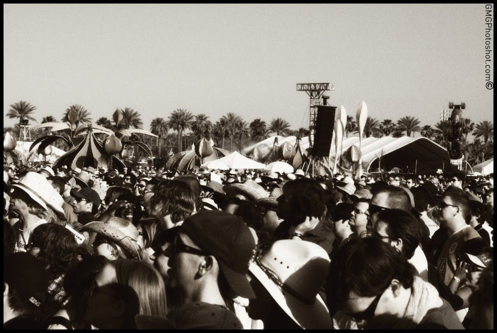 Crowds cheer at Coachella. Photo courtesy by GMGphotoshot (Giselle Greico) from Coachella 2008.