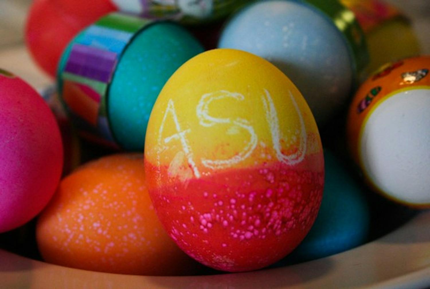 APPY EASTER: An ASU-themed Easter egg is set atop a basket of colored eggs to celebrate the holiday on Sunday. (Photo by Lisa Bartoli)