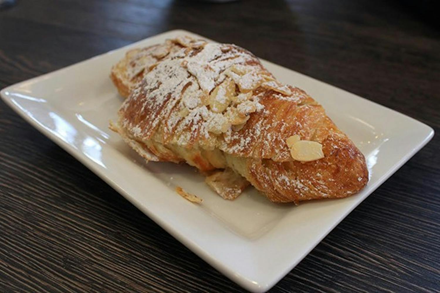 The almond croissant, as well as the Nutella Macchiato, are house favorites at Delice Bistro on Mill Ave. (Photo by Micaela Rodriguez)