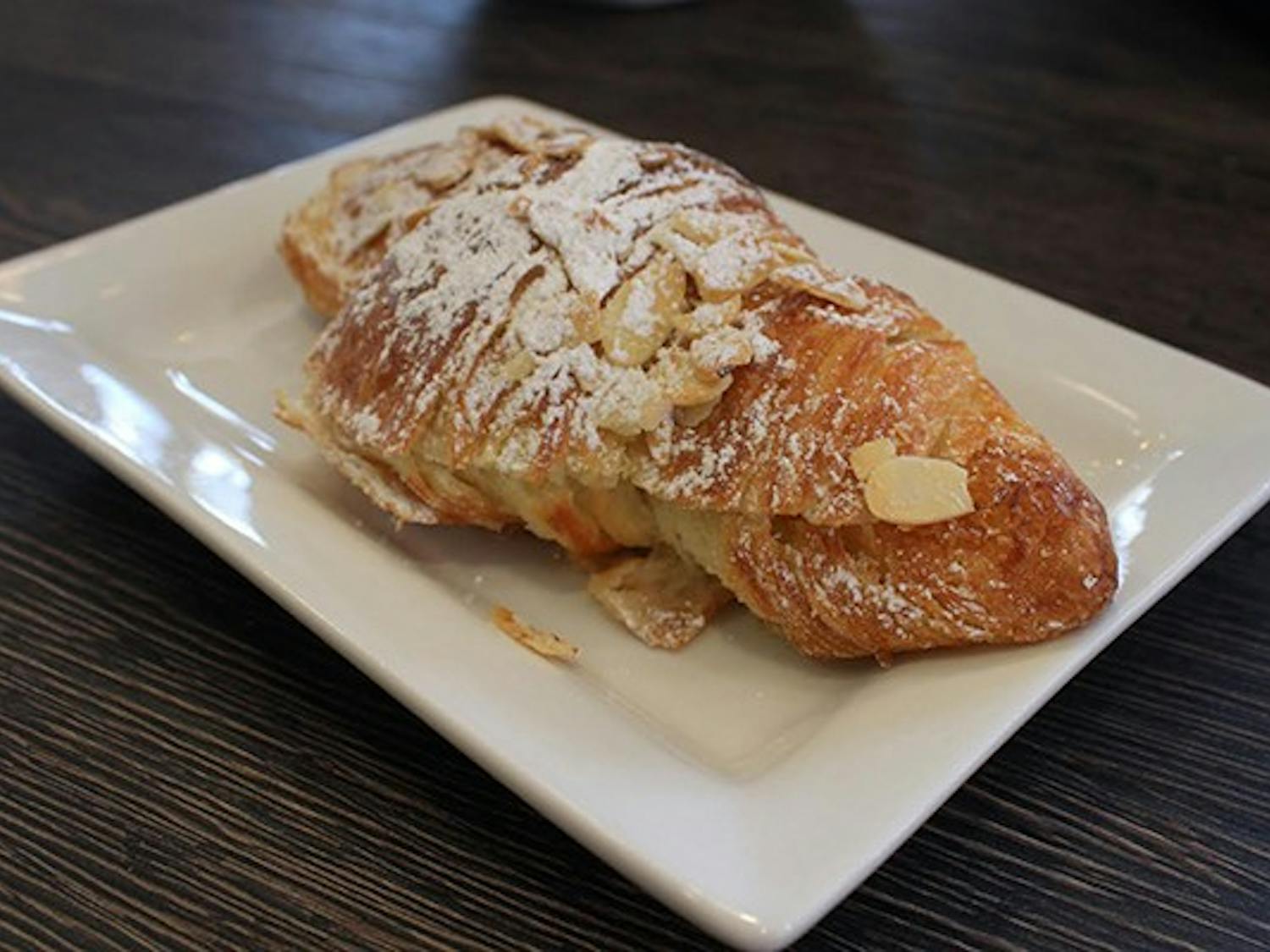 The almond croissant, as well as the Nutella Macchiato, are house favorites at Delice Bistro on Mill Ave.  (Photo by Micaela Rodriguez)
