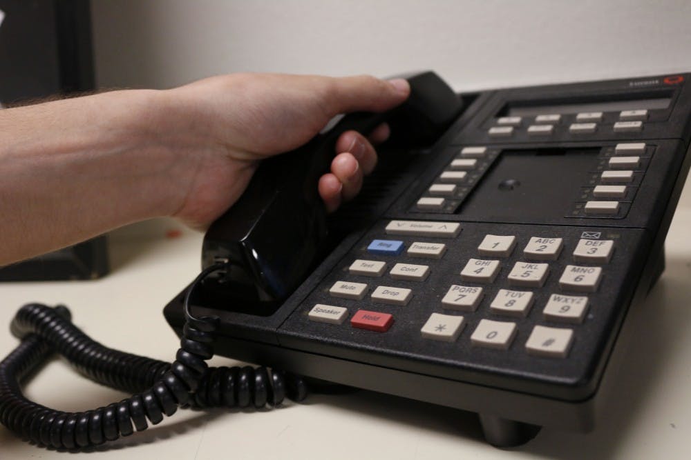Photo illustration of a person answering the phone taken on Thursday, April 13, 2017.
