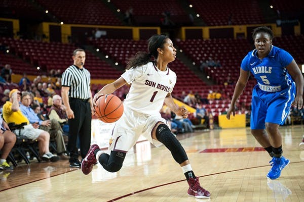 Junior guard Arnecia Hawkins drives to the basket in a game against Middle Tennessee, Friday. Nov. 14, 2014 at Wells Fargo Arena in Tempe. The Sun Devils defeated the Blue Raiders 81-67. (Photo by Ben Moffat)