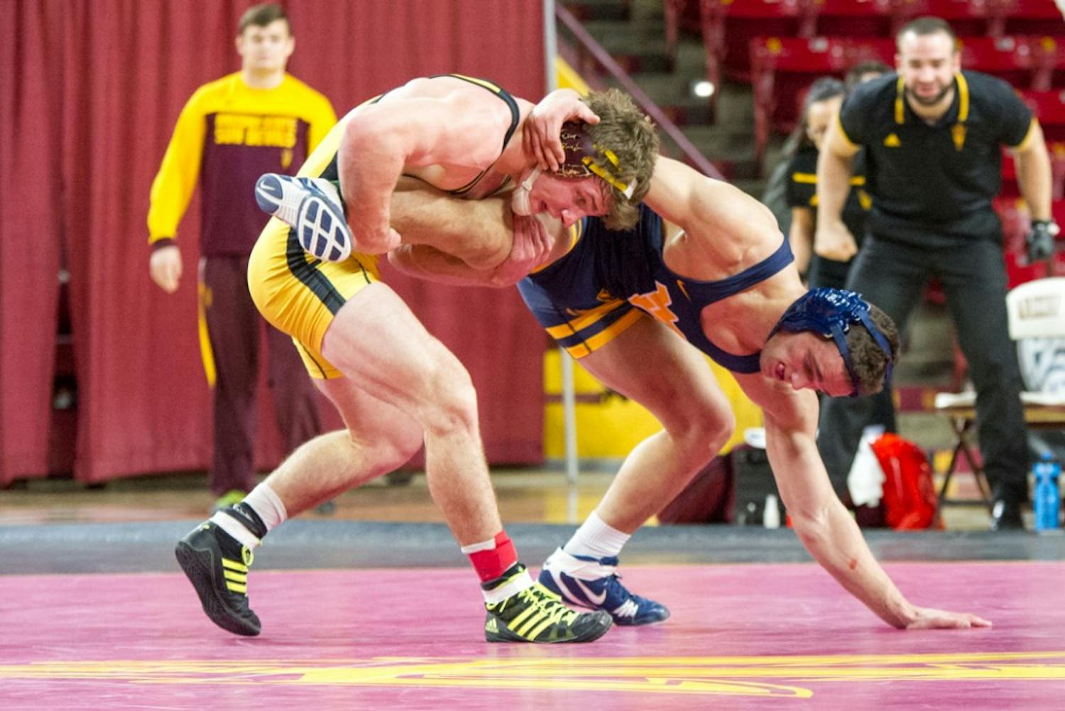 After four rounds of overtime, Jacen Peterson takes the match from WVU's Ross Renzi in a morning meet on Saturday, Jan. 23, 2016, at&nbsp; Wells Fargo Arena in Tempe, Arizona.