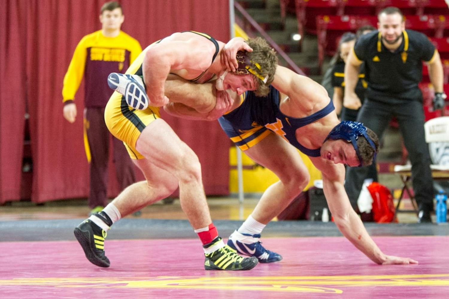 After four rounds of overtime, Jacen Peterson takes the match from WVU's Ross Renzi in a morning meet on Saturday, Jan. 23, 2016, at&nbsp; Wells Fargo Arena in Tempe, Arizona.