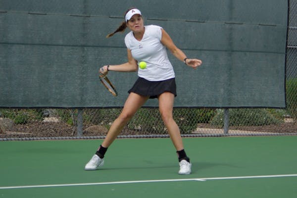 Inclement Weather: ASU senior Ashlee Brown winds up for the forehand against UCLA’s Maya Johansson during the No. 15 Sun Devils dual against the No. 8 Bruins on Saturday in Tempe. Rain postponed the match for several hours before UCLA topped ASU 4-2. (Photo by Nathan Meachem)