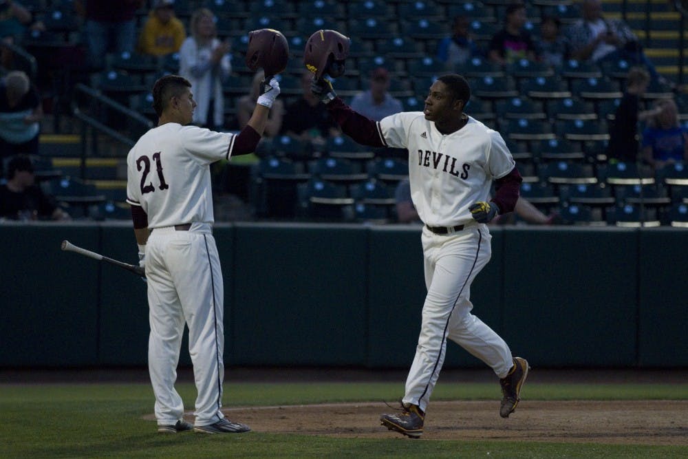 ASU sophomore outfielder Tyler Williams (25) celebrates with ASU freshman infielder Carter Aldrete (21) after hitting a home run during a baseball game against the UNLV Rebels at Phoenix Municipal Stadium in Phoenix on Tuesday, April 11, 2017. ASU won 5-3.