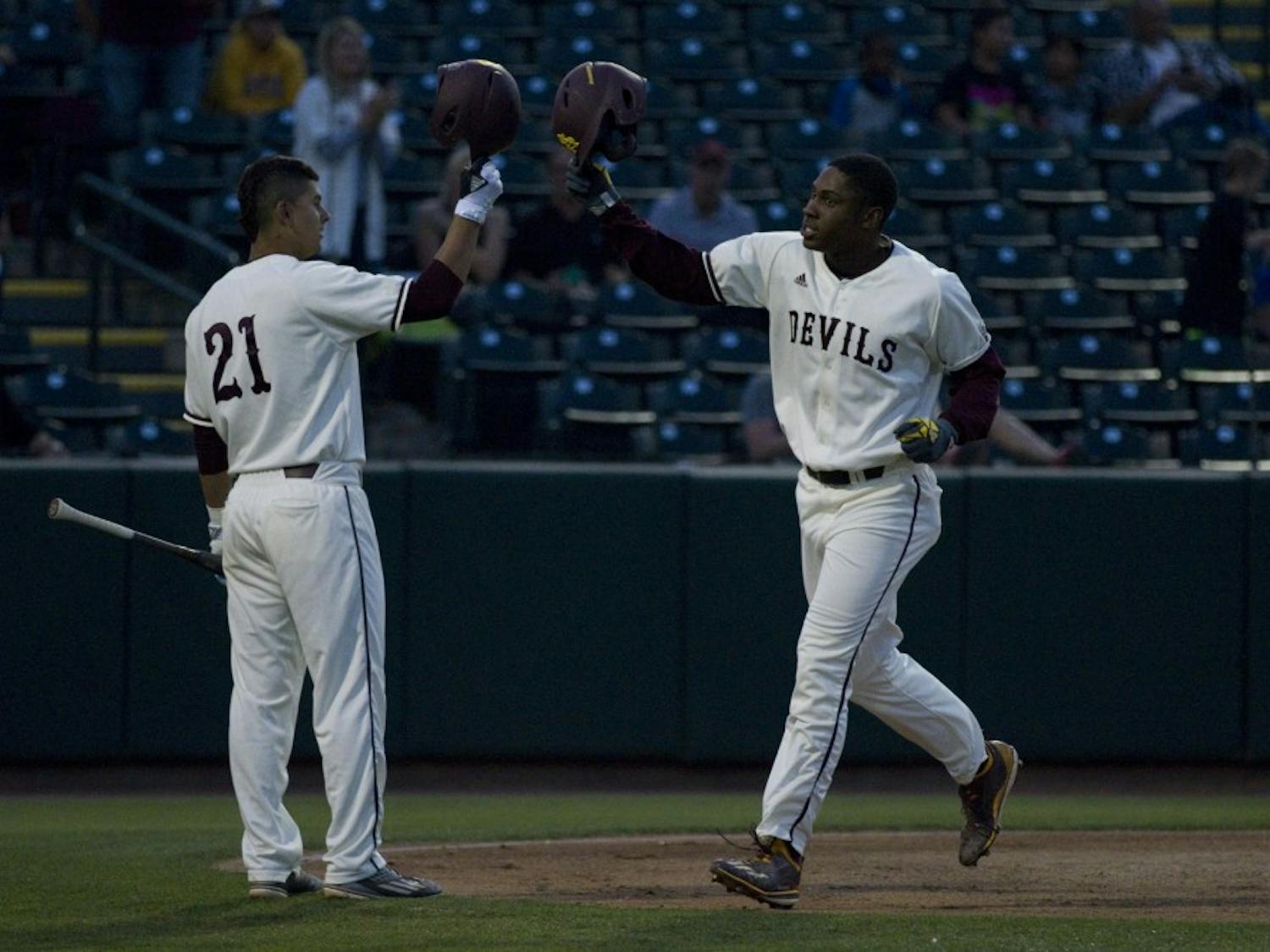 ASU sophomore outfielder Tyler Williams (25) celebrates with ASU freshman infielder Carter Aldrete (21) after hitting a home run during a baseball game against the UNLV Rebels at Phoenix Municipal Stadium in Phoenix on Tuesday, April 11, 2017. ASU won 5-3.