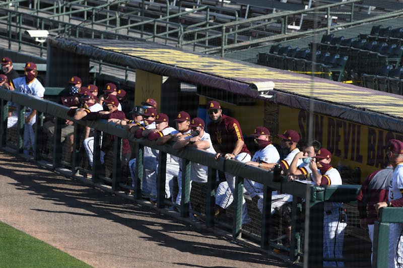 The ASU baseball team watches from the dugout during their game against the University of Hawai'i at Phoenix Municipal Stadium in Phoenix on Saturday, Feb. 27, 2021. ASU won 6-5.