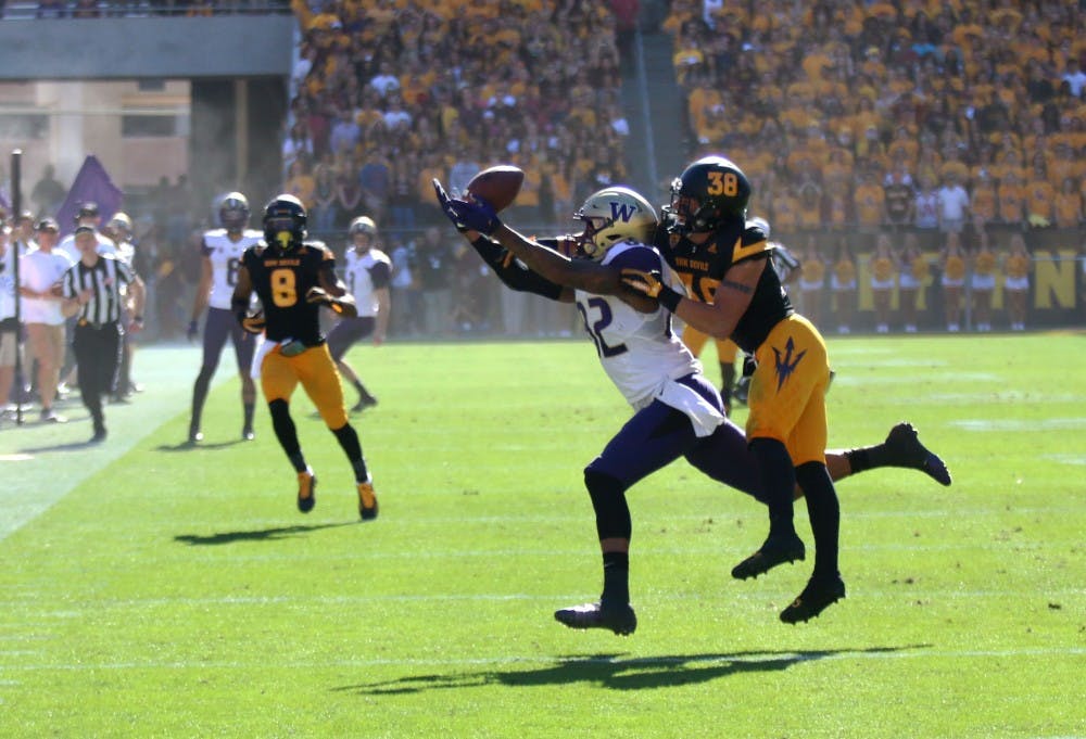 ASU redshirt senior safety Jordan Simone breaks up a pass intended for Washington senior tight end Joshua Perkins during the first half of ASU's game against the Huskies at Sun Devil Stadium on Nov. 14, 2015.