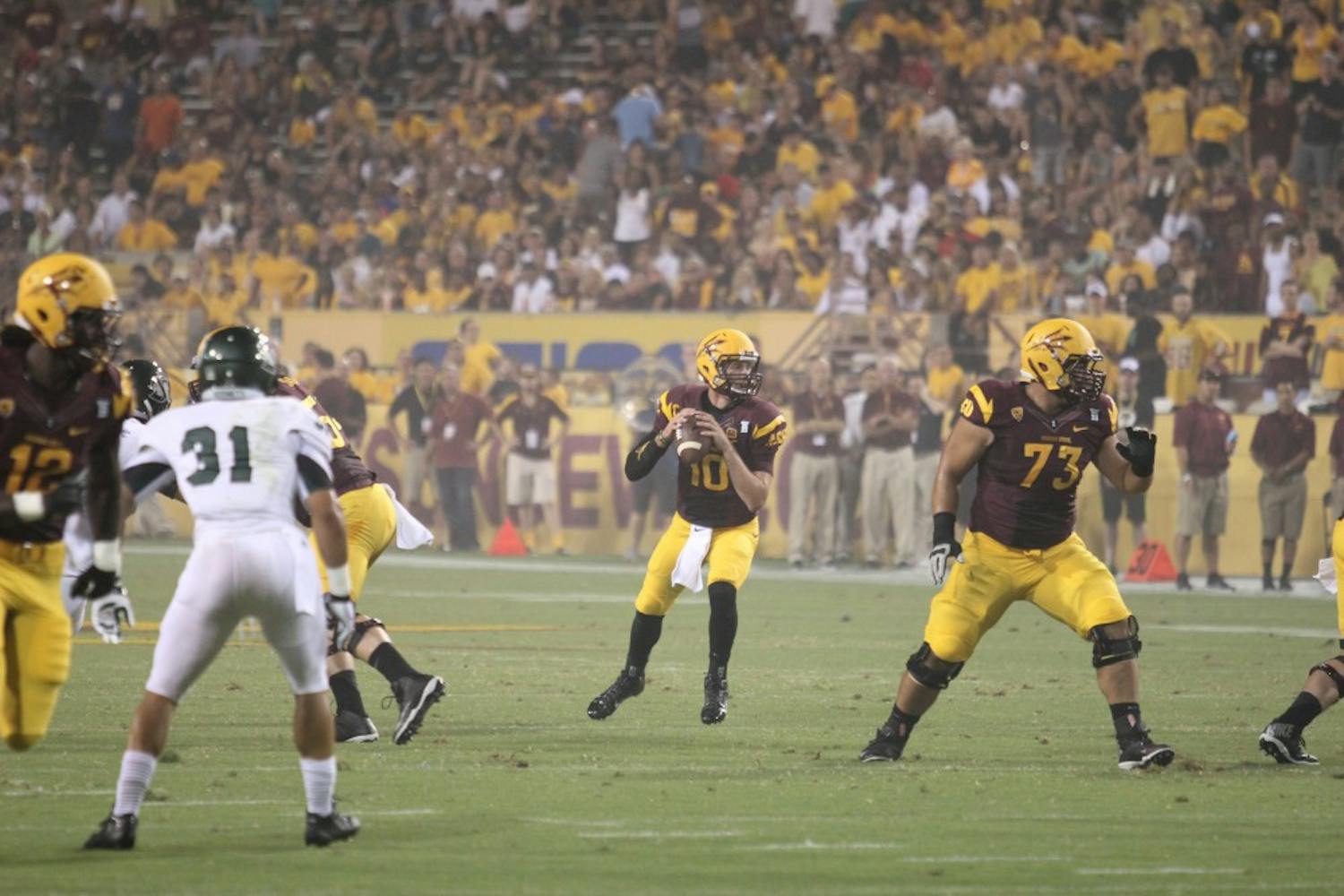Redshirt junior Taylor Kelly drops back for a pass against Sacramento State. On Saturday, the Sun Devils lost against Stanford 42-28. (Photo by Diana Lustig)