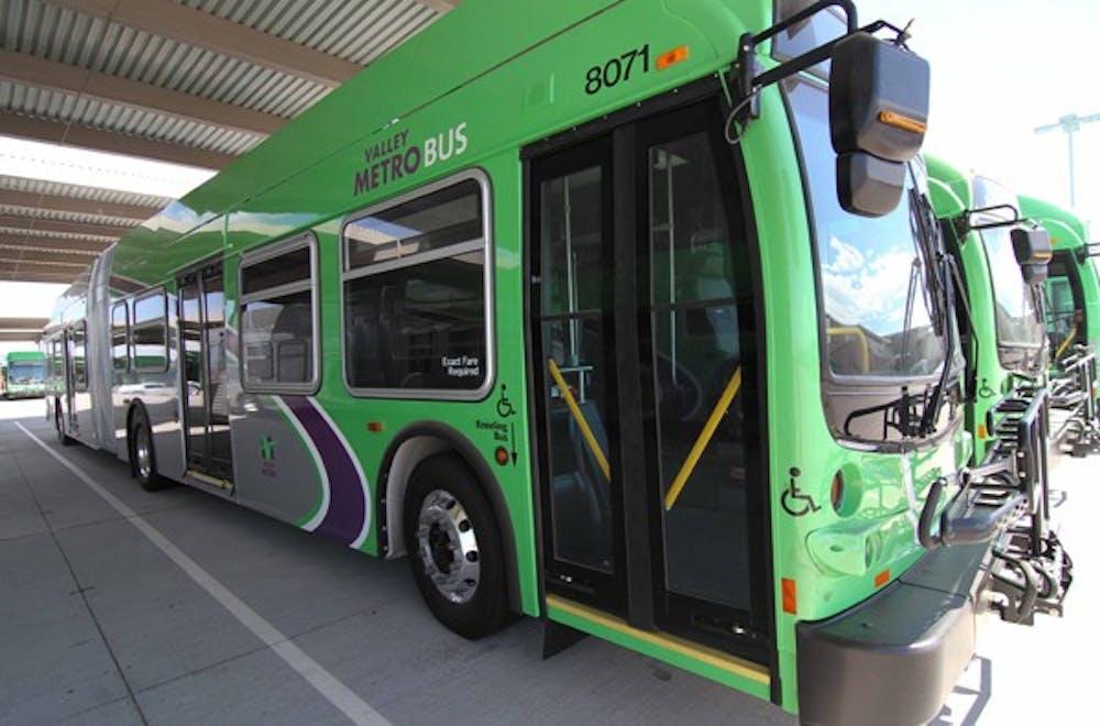 AWAITING DEPARTURE: New Valley Metro buses sit at the depot in Tempe Tuesday afternoon waiting to be inspected before being put into circulation. (Photo by Lisa Bartoli)