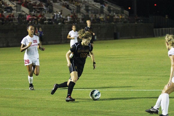 Junior midfielder Holland Crook handles the ball around the Houston defense during the Sun Devils’ 1-0 loss to the Cougars on Sept. 7. (Photo by Kyle Newman)