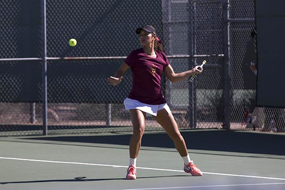 Sophomore Desirae Krawczyk swings at the ball during a match against San Jose State at home. (Photo by Diana Lustig)