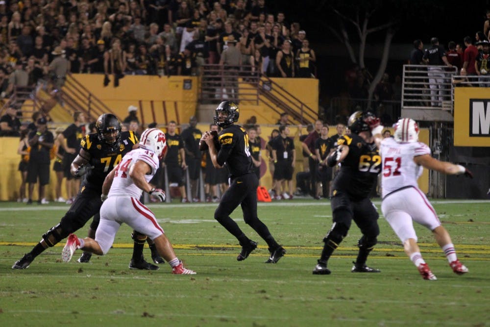 Redshirt junior Taylor Kelly prepares to throw the ball during the game against Wisconsin. Kelly was named Pac-12 Offensive Player of the Week, the third ASU player to be named a conference player of the week this season. (Photo by Diana Lustig)