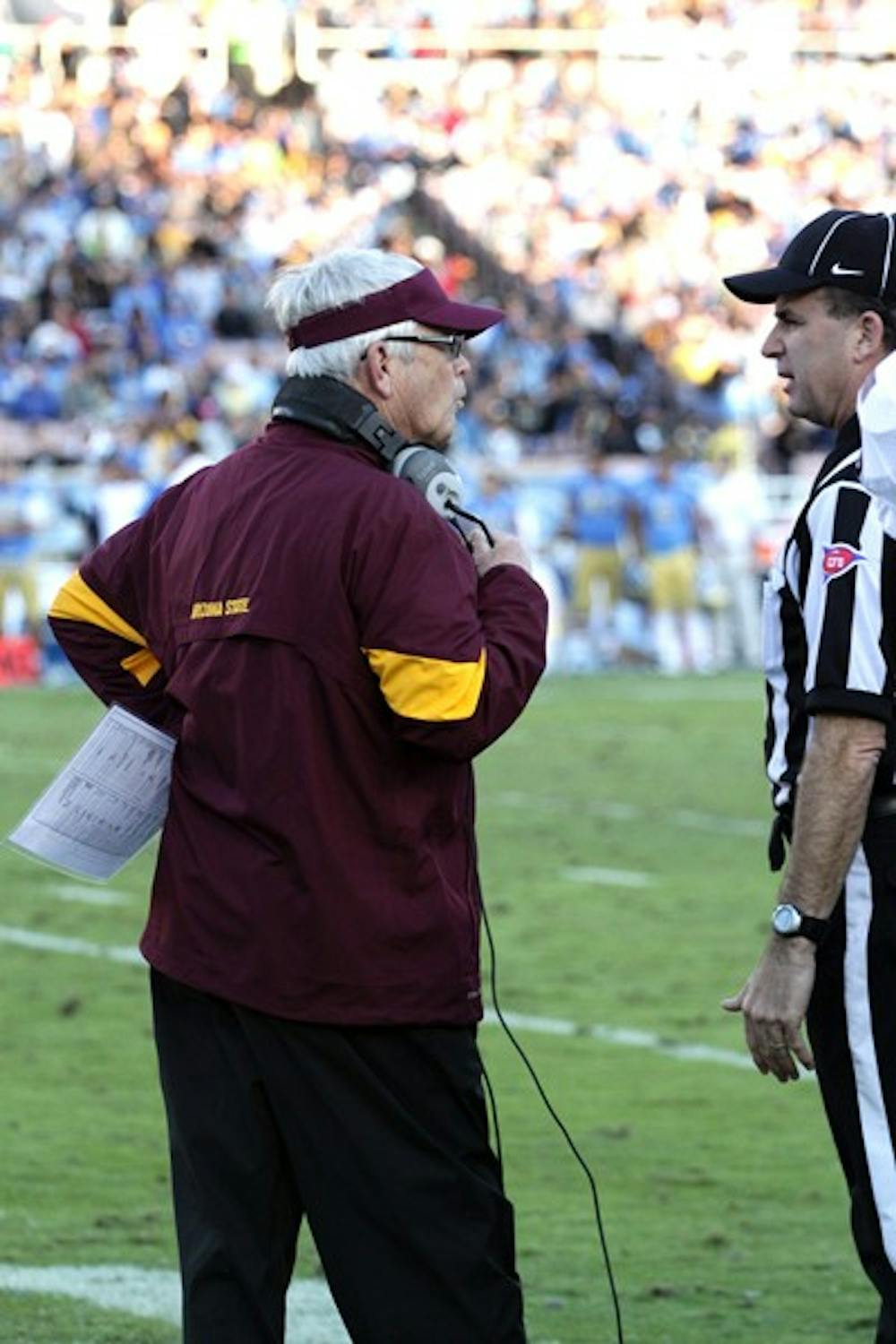TAKING BLAME: ASU coach Dennis Erickson argues with a referee during the second quarter of the Sun Devils’ loss to UCLA on Saturday. Erickson took some of the blame for the defeat with clock mismanagement in the fourth quarter. (Photo by Elijah Grasser)