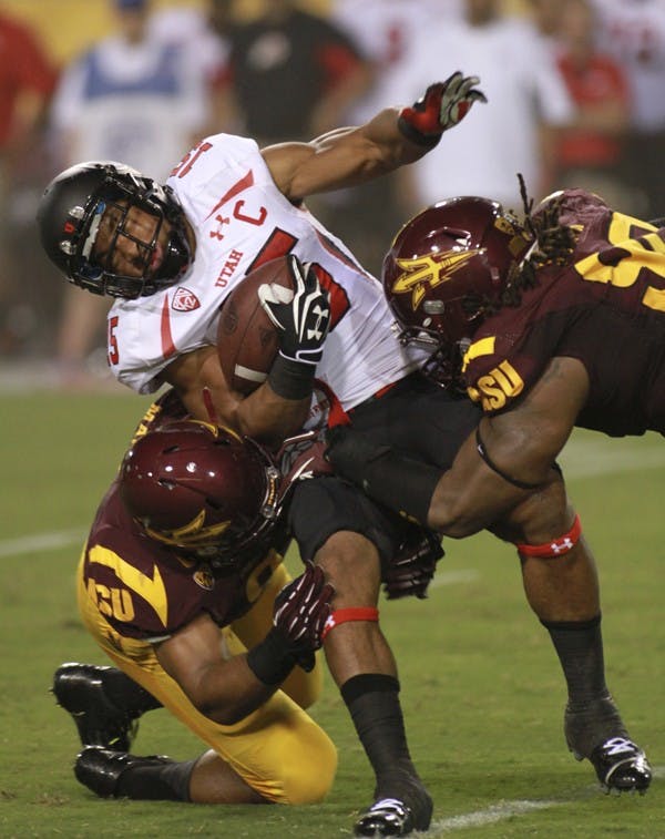 AMBASSADOR: ASU students and workers await for their train ride home at one of the stops on the ASU campus. The parking and transit system is setting up a new system to help new students with any light rail questions. (Photo By Andy Jeffreys)