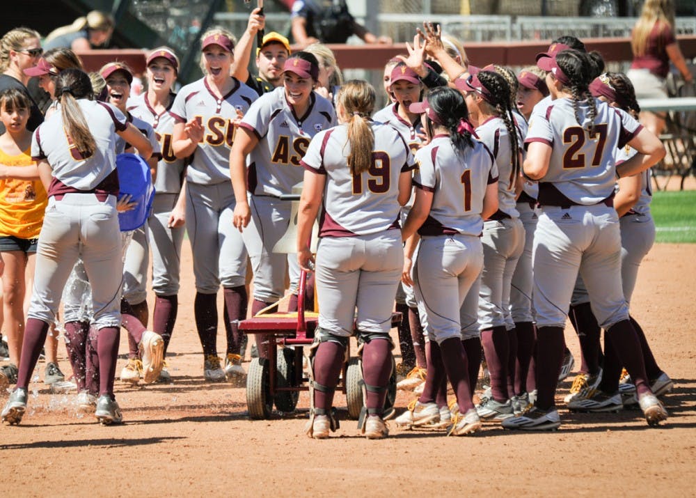 Second baseman Nikki Gerard is drenched with an ice water shower as the team&nbsp;gathers to ring the victory bell following its victory over Texas Tech on Saturday, March 26, 2016 at Farrington Stadium in Tempe, Arizona. Girard hit a grand slam to help ASU softball get the series sweep.