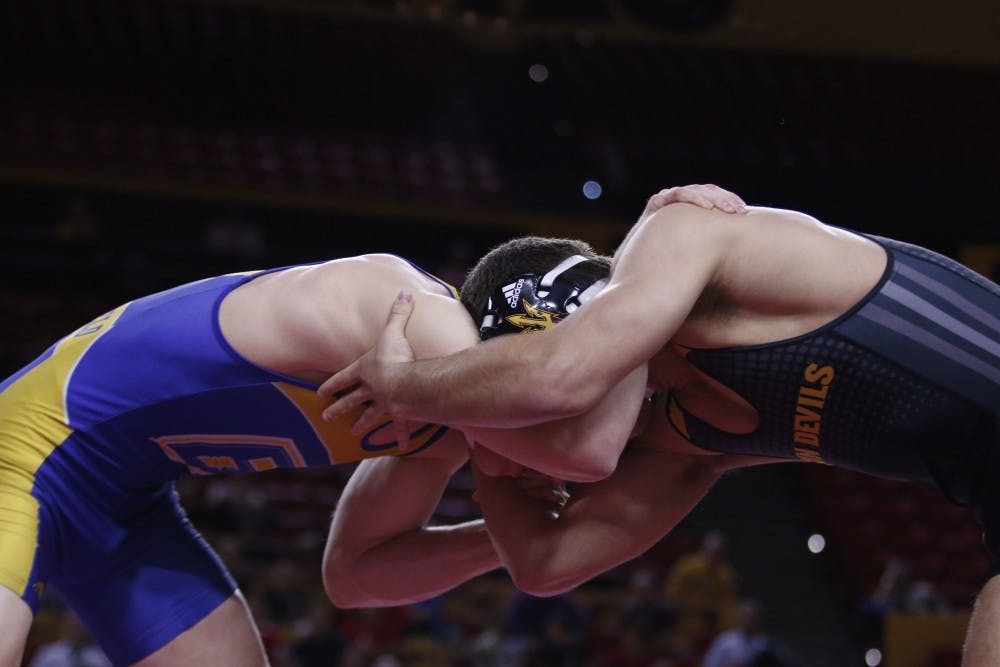 ASU’s Josh Shields squares off against CSU Bakersfield wrestler at the Wells Fargo Arena in Tempe, Arizona on Thursday, Feb. 9, 2017. ASU won overall 26-15.