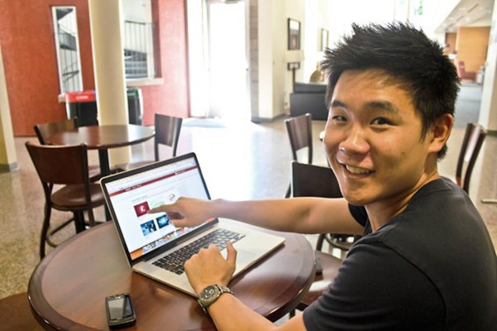 Finance and computer information systems junior Keith Ryu navigates through his website Onvard.com.  Ryu is co-founder and CEO of Onvard and is focused on guiding students to research study resources.  (Photo by Marissa Krings)