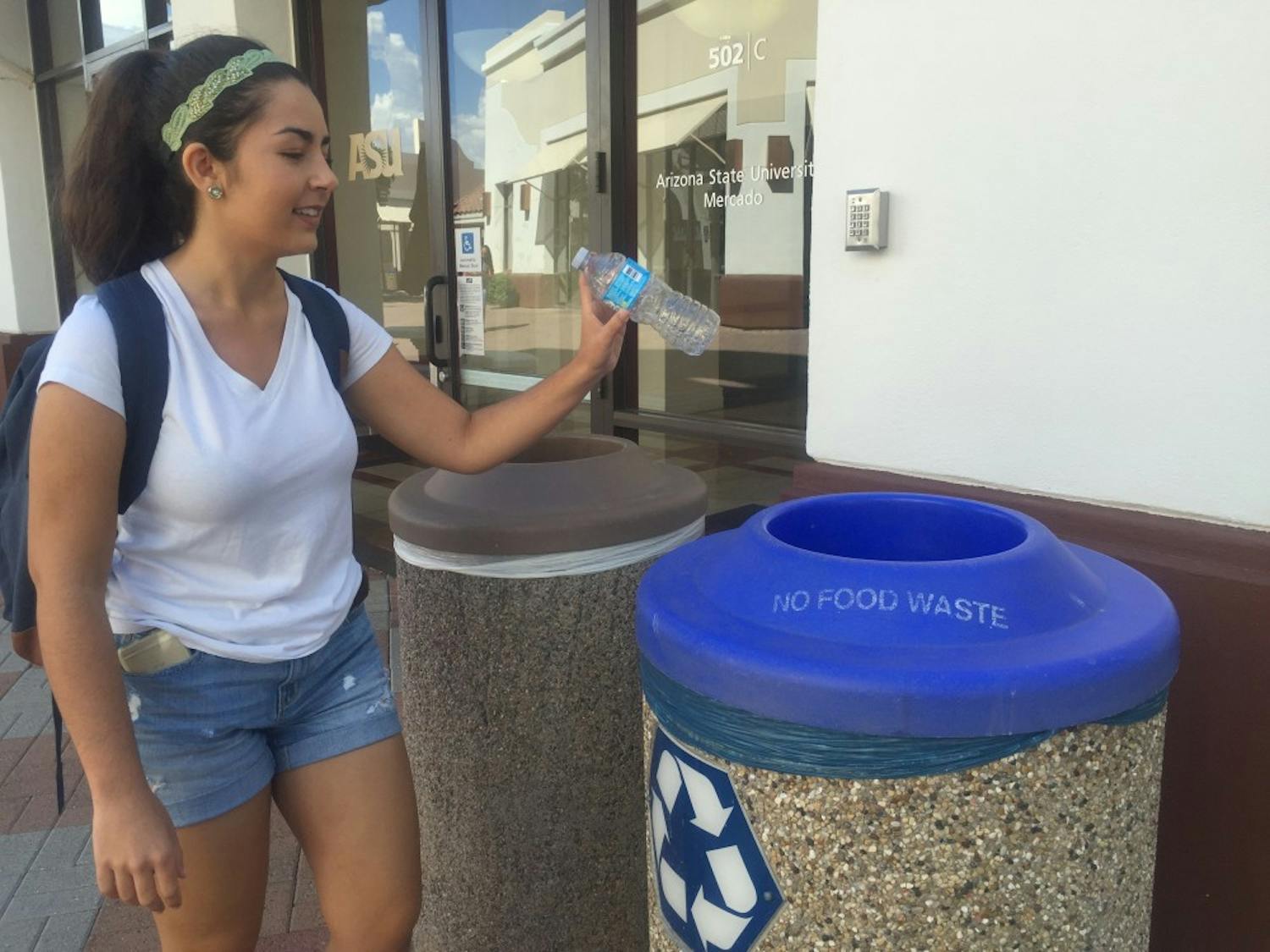 Sophomore journalism student Lauren Intrieri recycles her water bottle on the Downtown Phoenix Campus on Tuesday, Aug. 30, 2016