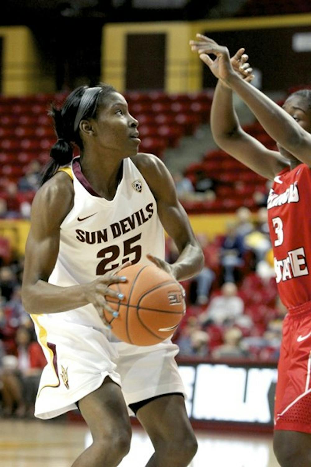 ASU senior guard/forward Kimberly Brandon (left) looks to shoot over Illinois State junior guard Candace Sykes during the Sun Devils’ 77-54 win over the Red Birds on Saturday. The Sun Devils won both of their games at the annual ASU Classic at Wells Fargo Arena over the weekend. (Photo by Sam Rosenbaum)