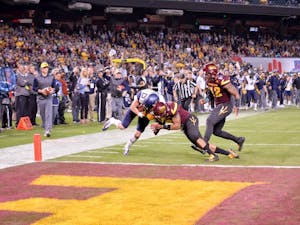 Freshman David Sills, in at wide&nbsp;receiver, makes the catch and crosses the goal line amid defensive pressure to score WVU's final touchdown during the 2016 Motel 6 Cactus Bowl. The Mountaineers wins over ASU 43 - 42 at Chase Field in Phoenix, AZ.