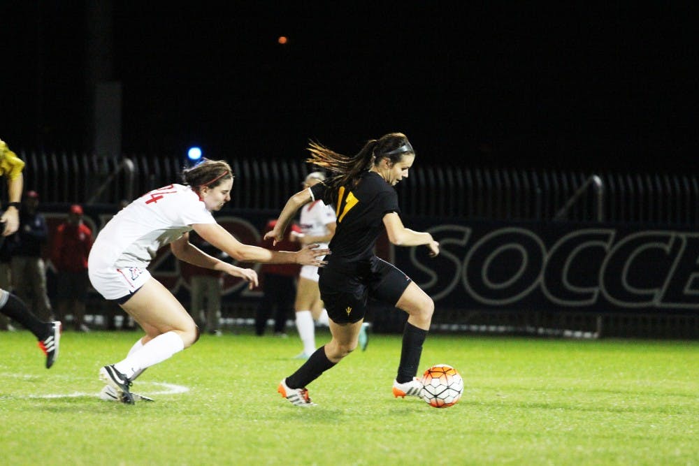 Senior forward Cali Farquharson gets the ball against University of Arizona at the Mulcahy Stadium in Tucson