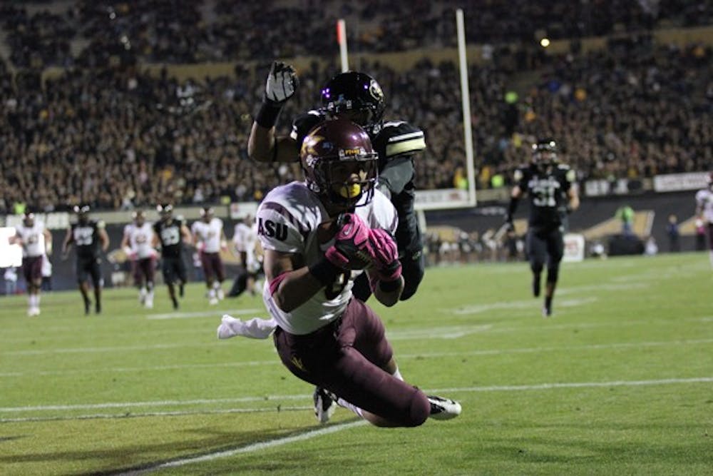 Freshman running back D.J. Foster makes a diving catch for a touchdown during the Sun Devils’ 51-17 win over Colorado on Thursday. (Photo by Kyle Newman)