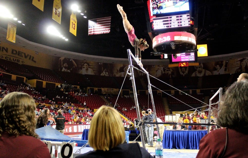ASU junior Stephanie Miceli scores 9.725 on the uneven bars, but the team lost to Oregon State in a tough defeat at Wells Fargo Arena on Feb. 20, 2015. (Kat Simonovic/The State Press)