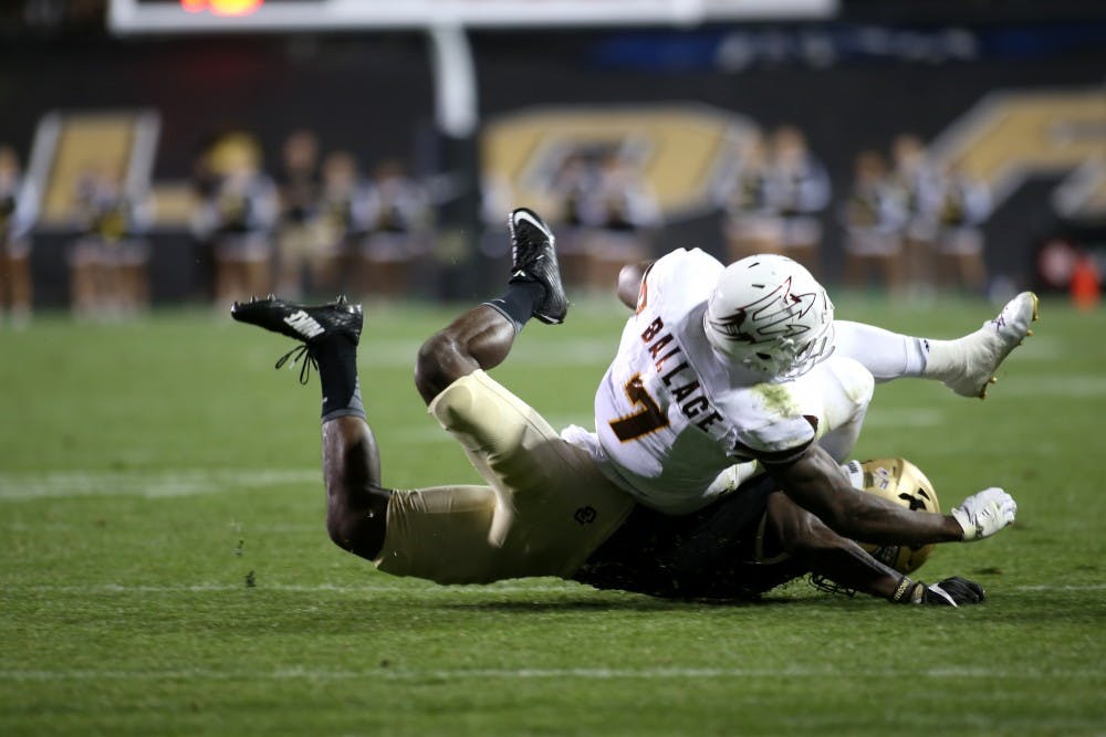Arizona State junior wide receiver Kalen Ballage is taken down by Colorado defense on Saturday, Oct. 15, 2016, in Folsom Field in Boulder, Colorado. The Colorado Buffaloes went on to defeat the Sun Devils 40-16.