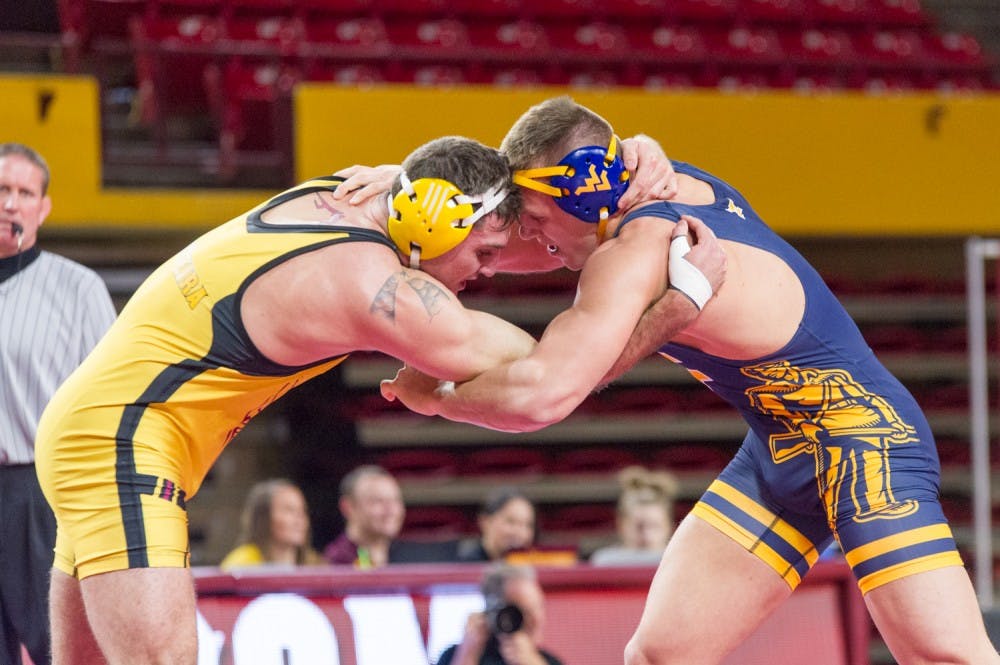 Arizona State wrestling came out with a win over West Virginia at the match&nbsp;Saturday, Jan. 23, 2016, after judges tallied individual points and found&nbsp;Tanner Hall had enough points to win his own match and put ASU above WVU, 53-49.