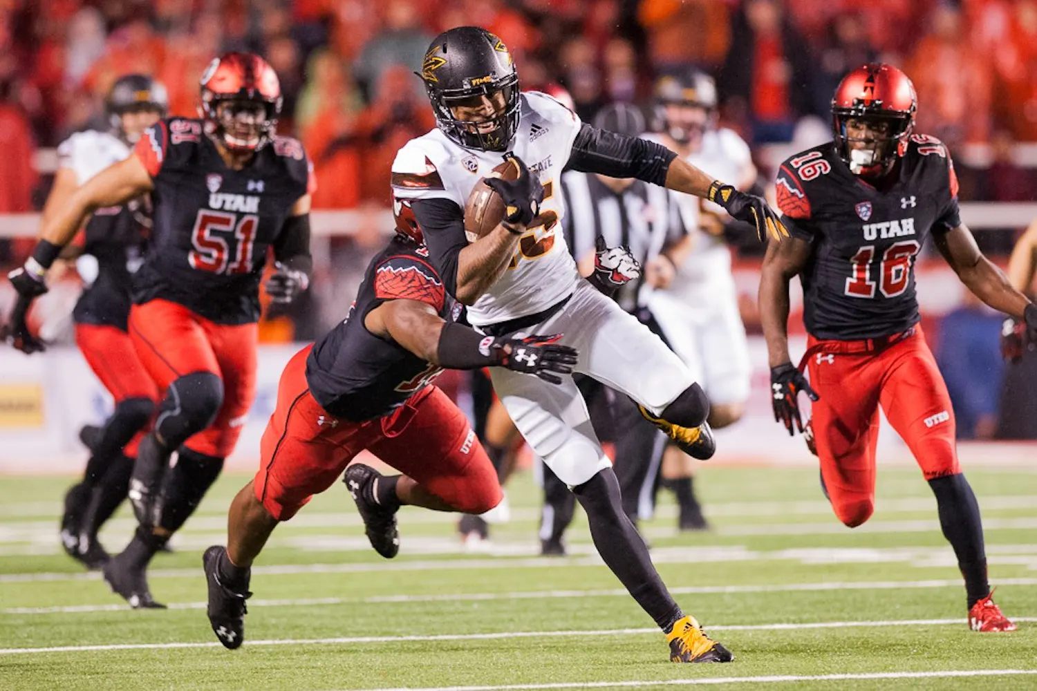 Redshirt senior wide receiver Devin Lucien (15) runs with a pass against Utah on Saturday, Oct. 17, 2015, at Rice-Eccles Stadium in Salt Lake City, Utah.