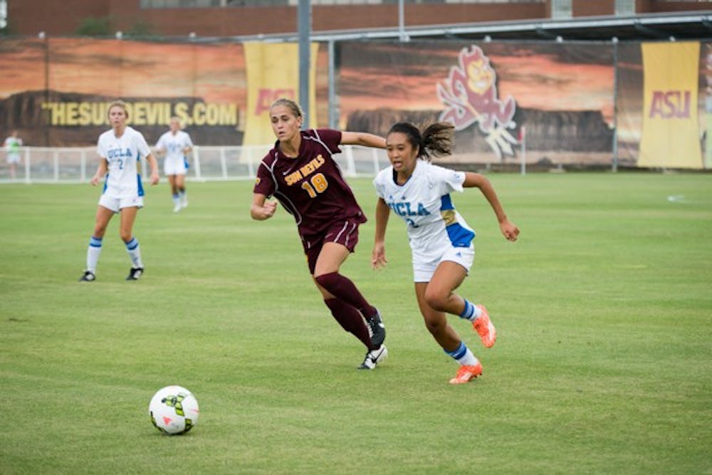 Redshirt junior forward/midfielder Mackenzie Semerad races UCLA's Caprice Dydasco for control of the ball during the game on Sept. 26 in Tempe. ASU tied UCLA 1-1. (Photo by Andrew Ybanez)