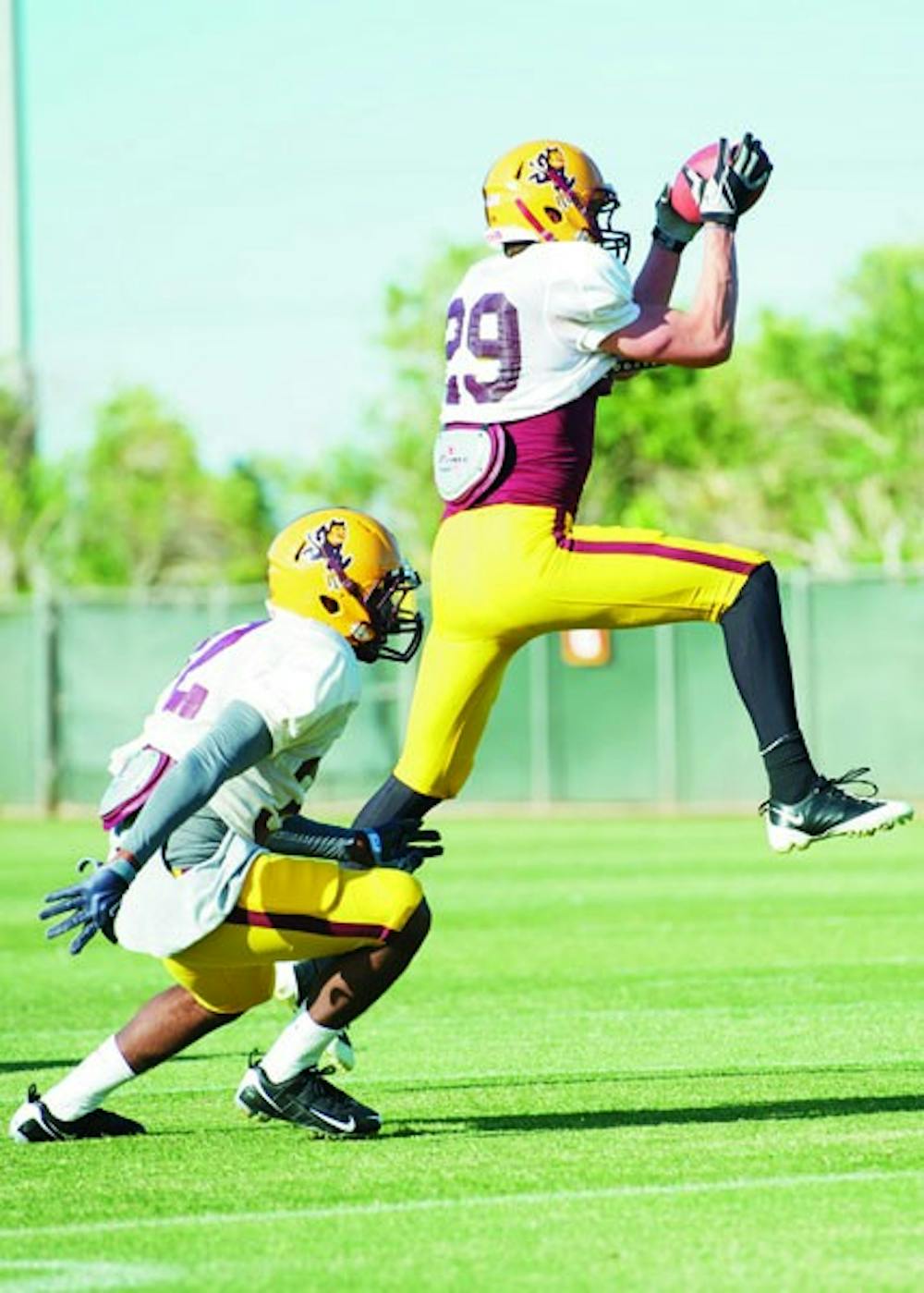 IT'S MINE: ASU freshman safety Shane McCullen intercepts a pass during a spring practice last week. (Photo by Michael Arellano)